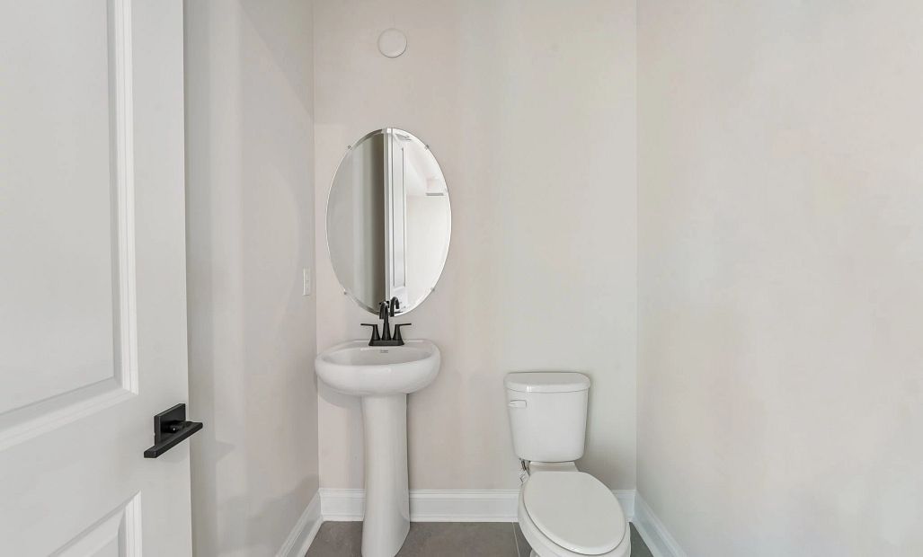Located conveniently off the family room is a half bathroom perfect for guests