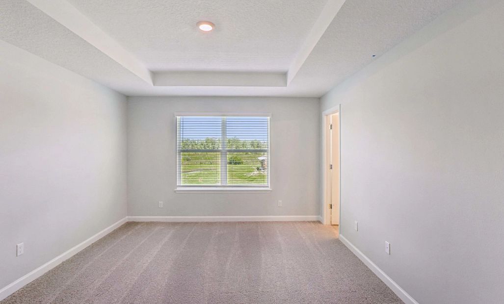 Primary Bedroom Featuring Tray Ceiling - representative images