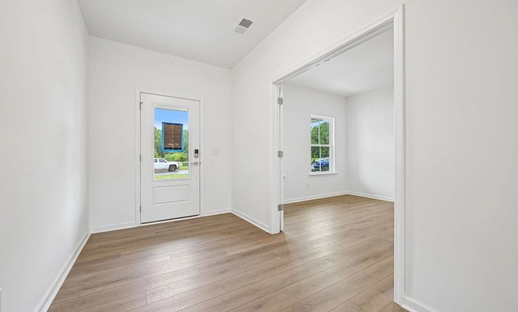 Foyer featuring the AW Collection® Milan - An entry with sleek tones and gallery-style flair.