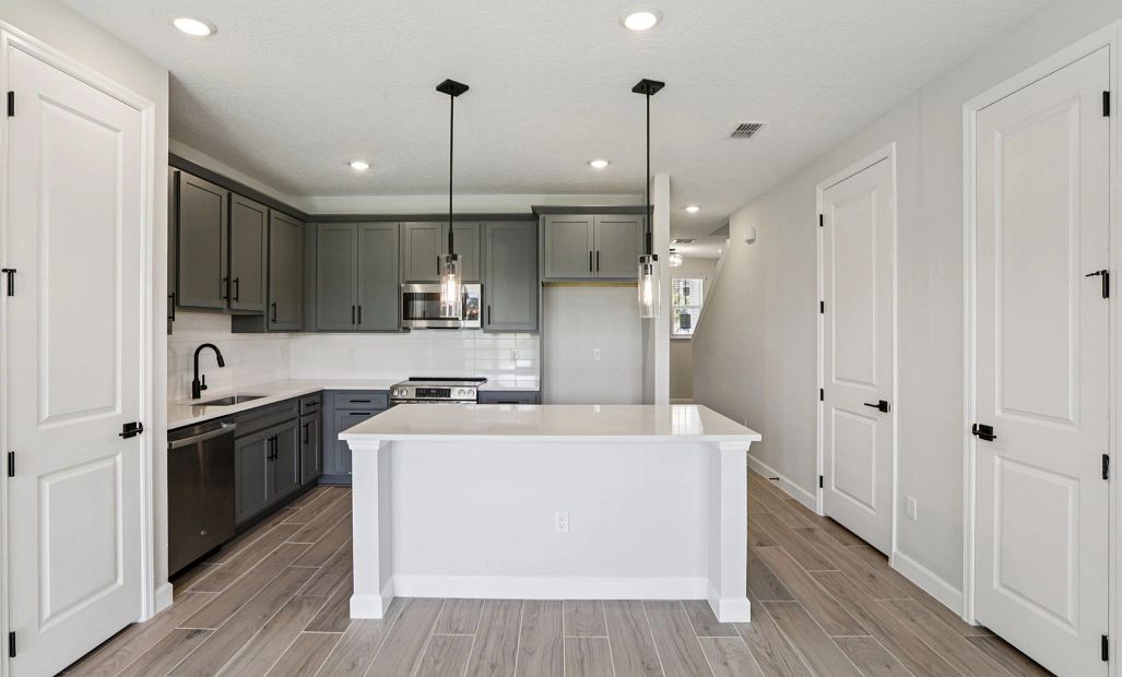 Kitchen with large island featuring AW Collection® Minimalist - Representative images and renderings