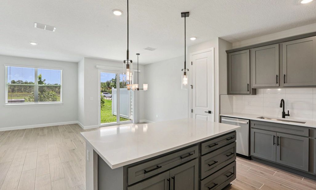 Kitchen opens up into the dining room and family room space - Representative images and renderings