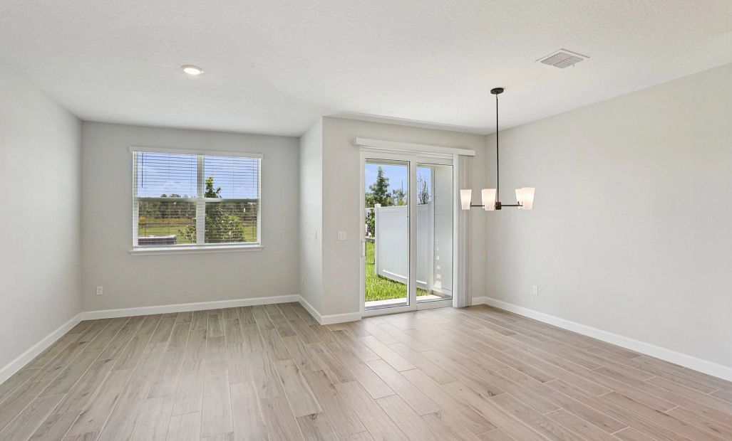 Open concept dining and family room - Representative images and renderings are for illustrative