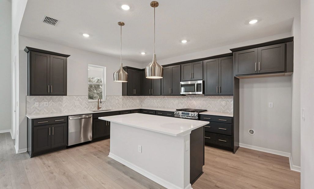 Spacious kitchen layout featuring a large island - representative image this home will feature AW