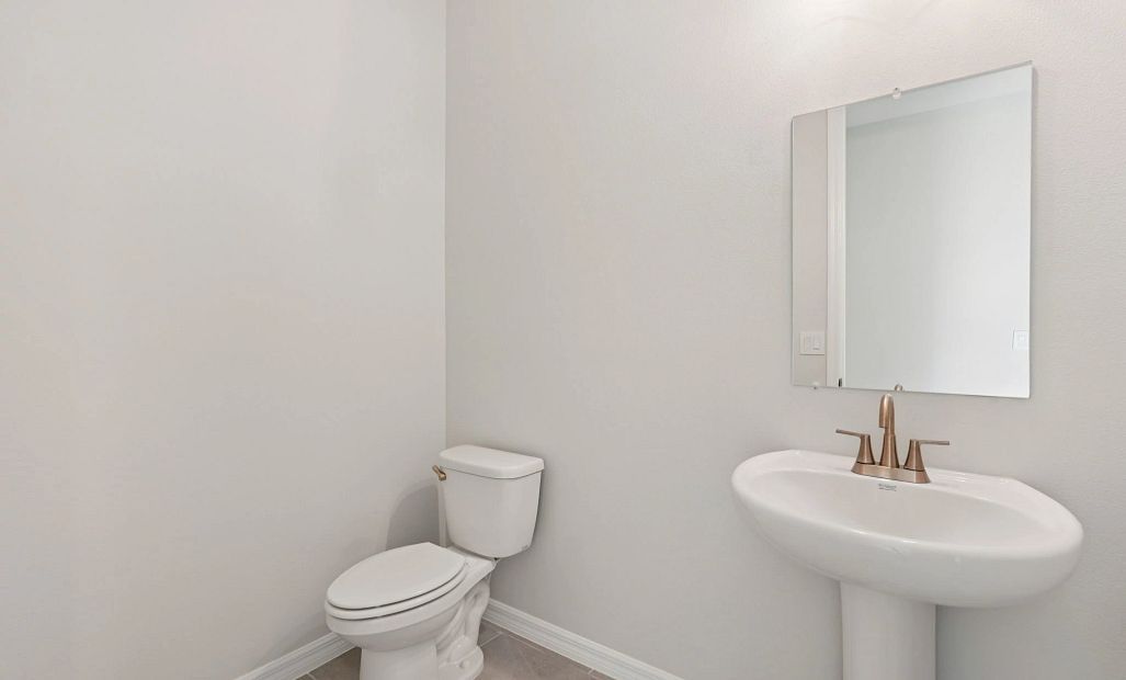 Half bathroom located off the foyer - representative image