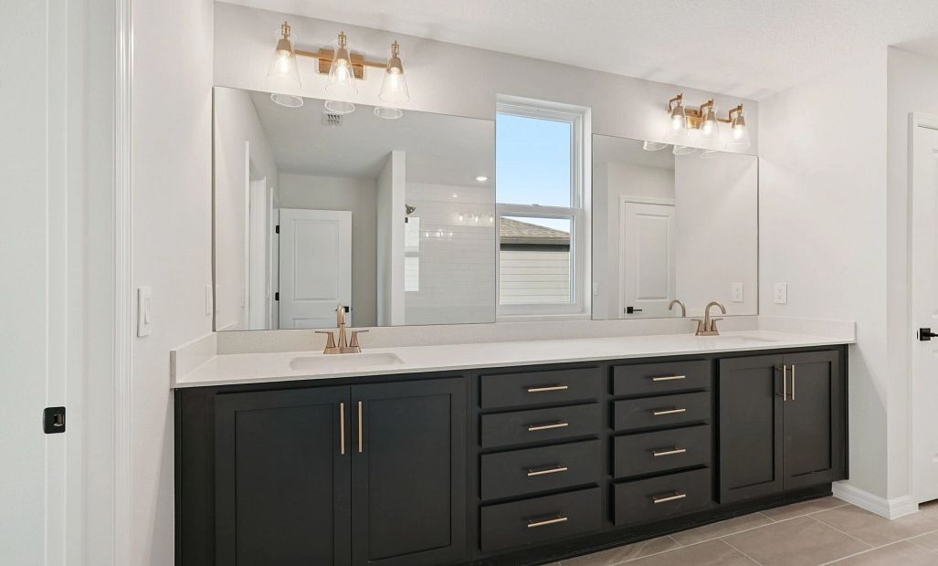 Primary bathroom featuring double sinks - representative image this home will feature AW Collection®