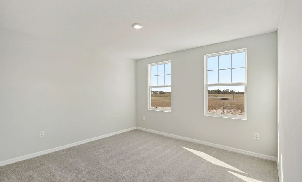 Bedroom 2 located off the front of the home - representative image