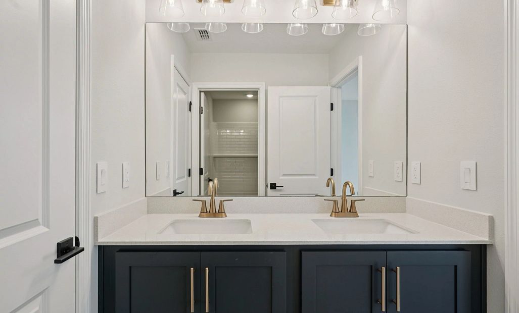 Bathroom 2 featuring double sinks - representative image this home will feature AW Collection®