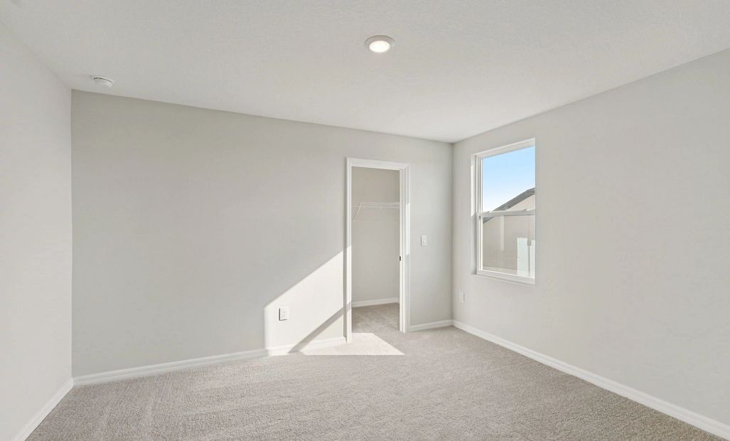 Bedroom 4 located off the back of the home - representative image