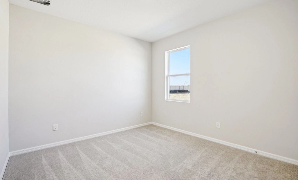 Bedroom 2 located just off the front foyer - Representative images and renderings are for