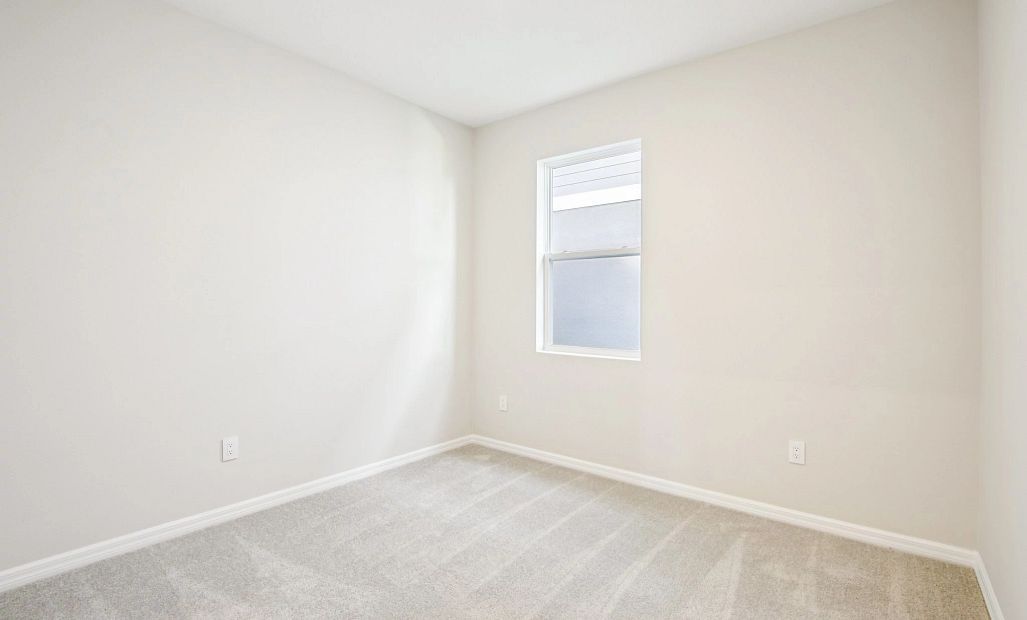 Bedroom 4 located off the garage hallway - Representative images and renderings are for illustrative