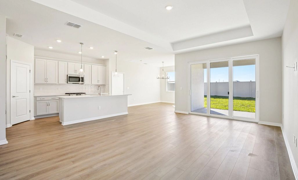 Open concept layout make the kitchen and family room feel well connected - Representative images and
