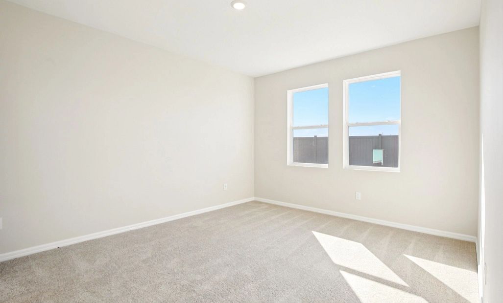 Primary bedroom with double windows this room will feature a tray ceiling - Representative images