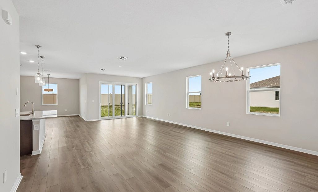 The foyer opens up into the spacious dining, living and kitchen spaces