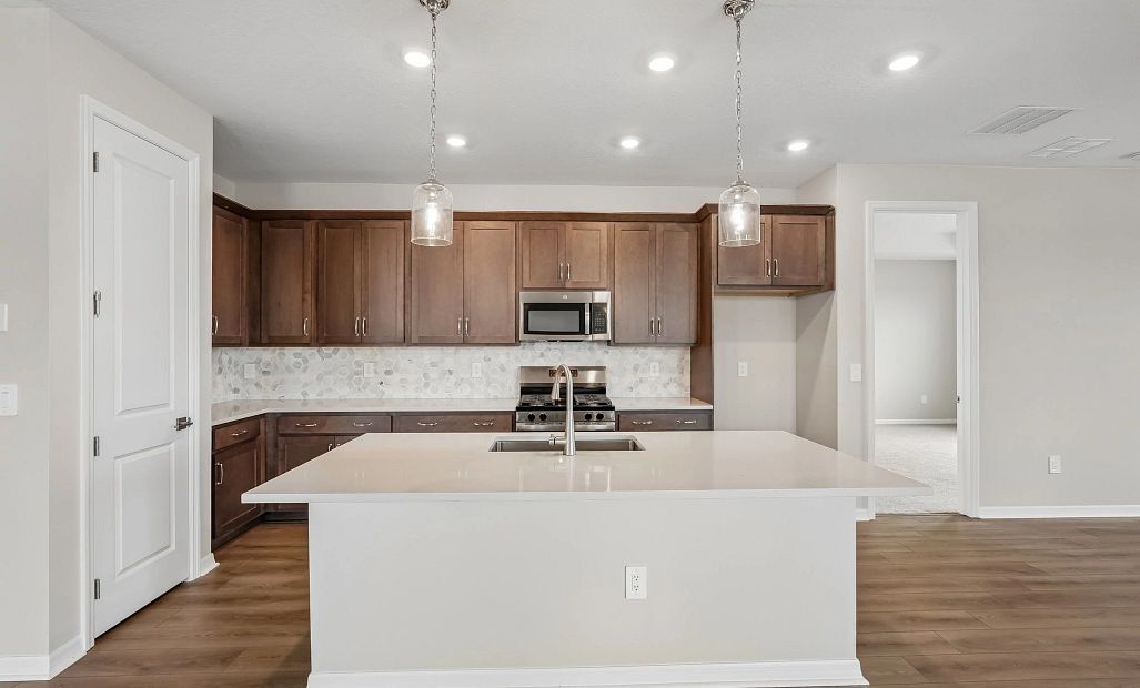 Spacious kitchen features our AW Collection® Roosevelt and a large island