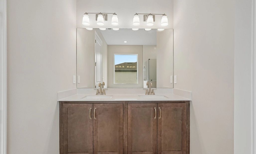 Primary bathroom has two sinks and features aspects of our AW Collection® Roosevelt