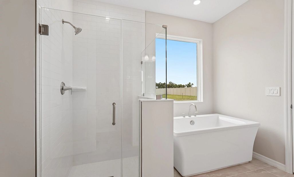 The primary bathroom has a large walk-in shower
