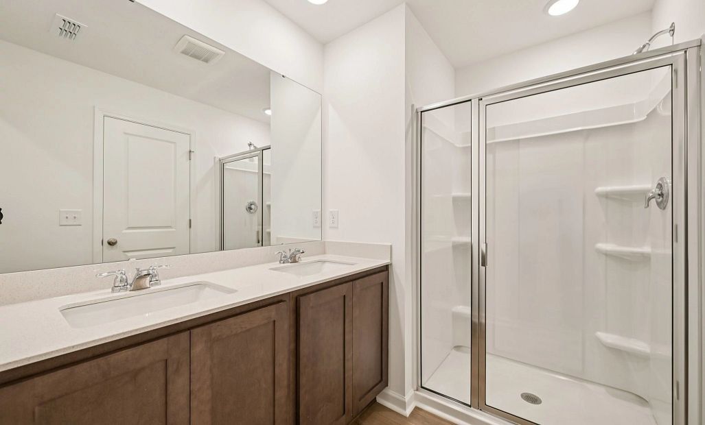 Primary Bath featuring the AW Collection® Roosevelt - Elegant tile and bold hardware finishes.