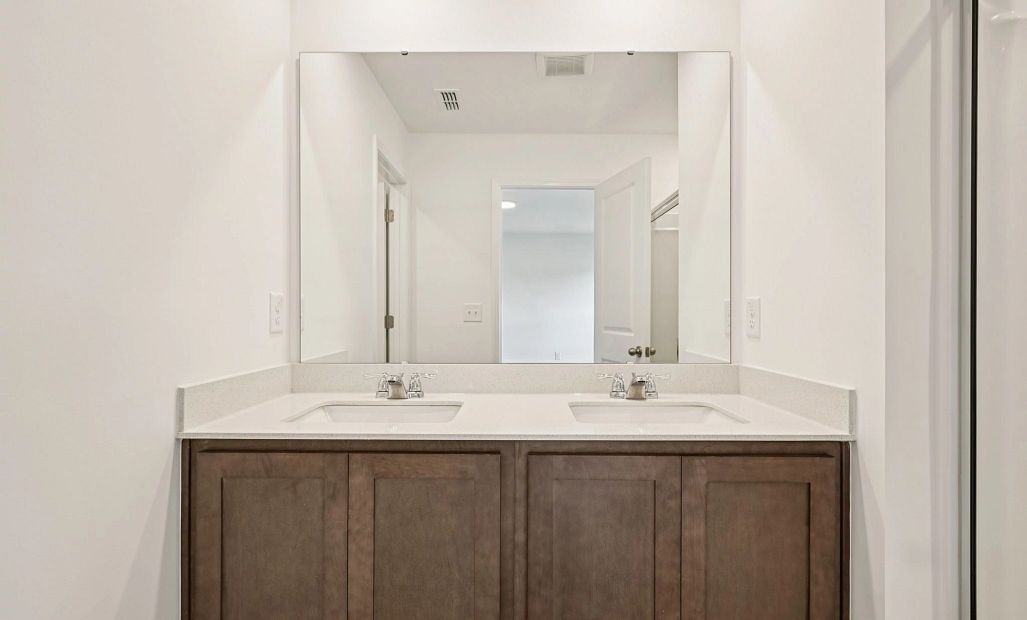 Primary Bath featuring the AW Collection® Roosevelt - Elegant tile and bold hardware finishes.