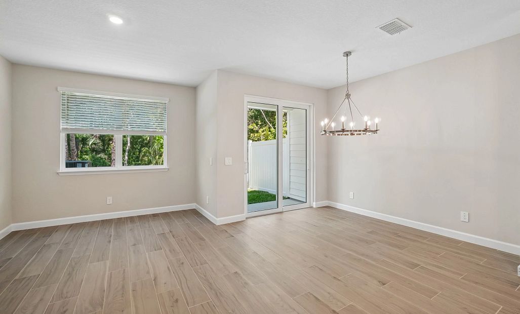 Open concept family room and dining room making it the perfect entertaining space - Representative
