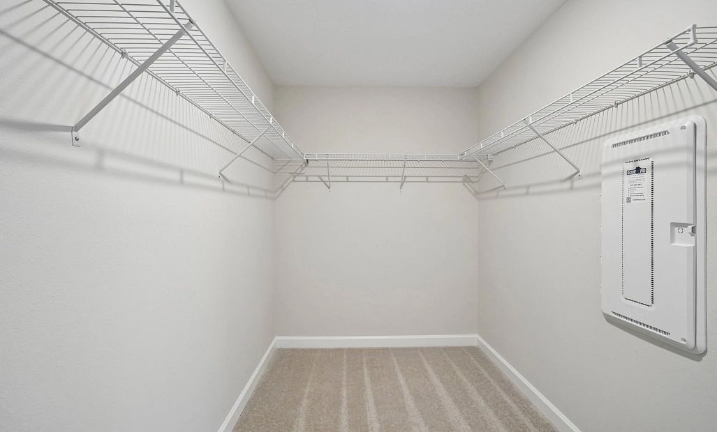 Spacious walk-in closet located off the primary bedroom - Representative images and renderings are