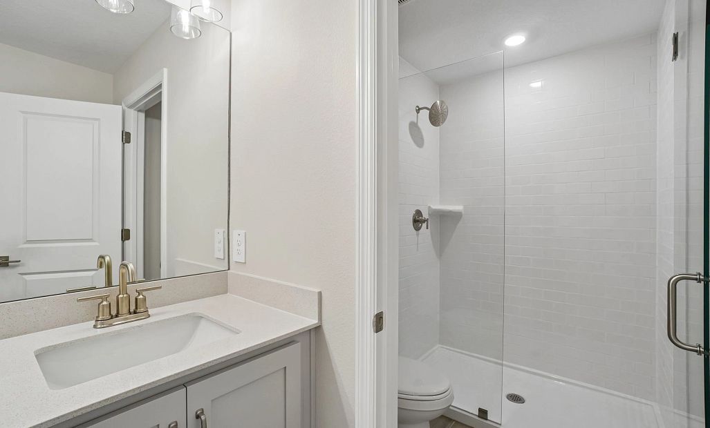 Beautiful primary bathroom featuring AW Collection® Milan and double sinks - Representative images