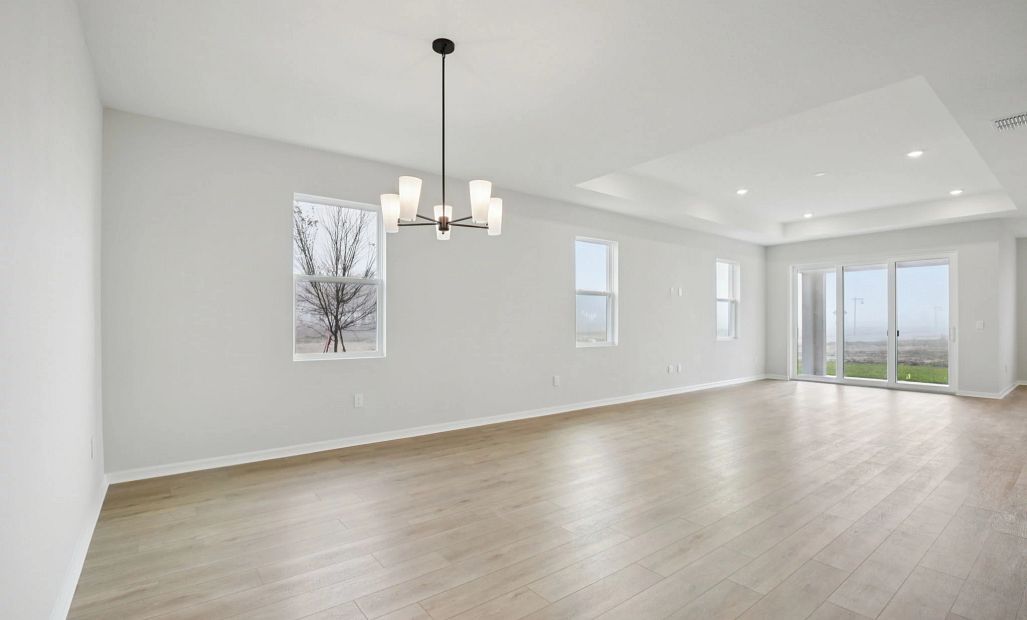 Dining space opens up into the family room space - Representative images and renderings are for