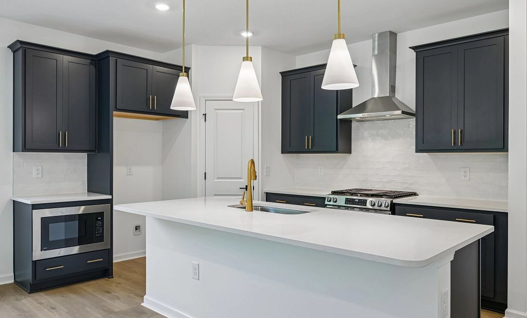 Kitchen featuring the AW Collection® Sapphire - Vibrant blues and crisp whites steal the show.