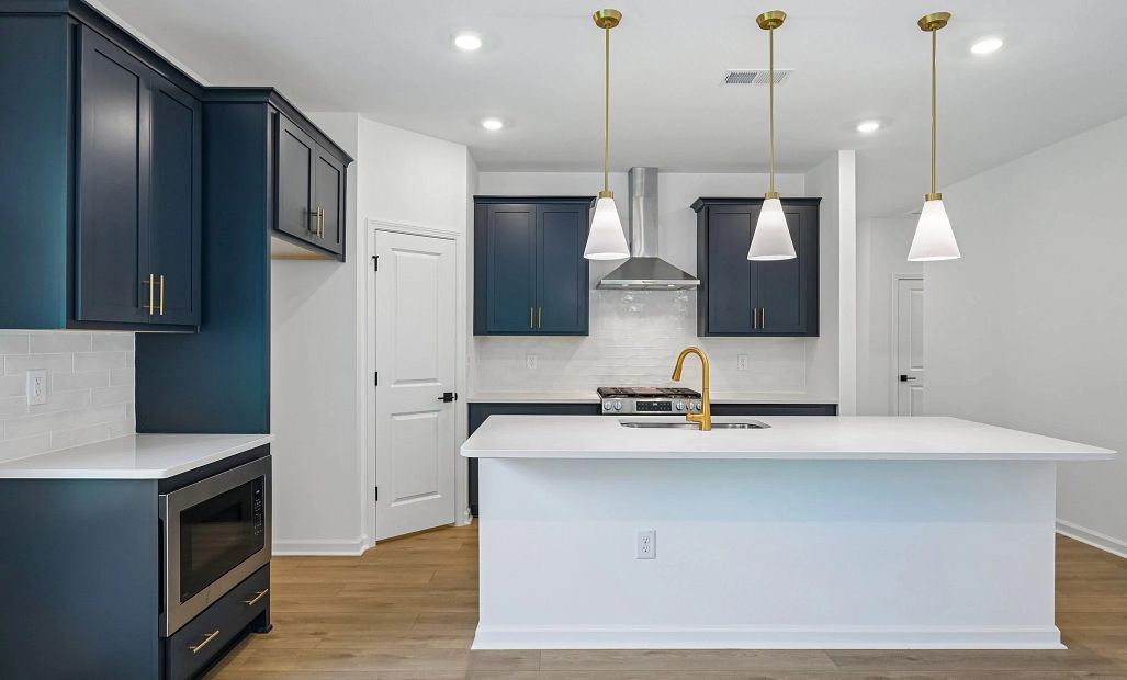 Kitchen featuring the AW Collection® Sapphire - Vibrant blues and crisp whites steal the show.