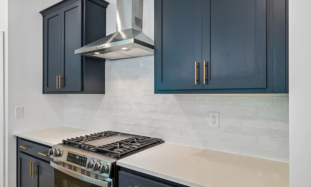 Kitchen featuring the AW Collection® Sapphire - Vibrant blues and crisp whites steal the show.