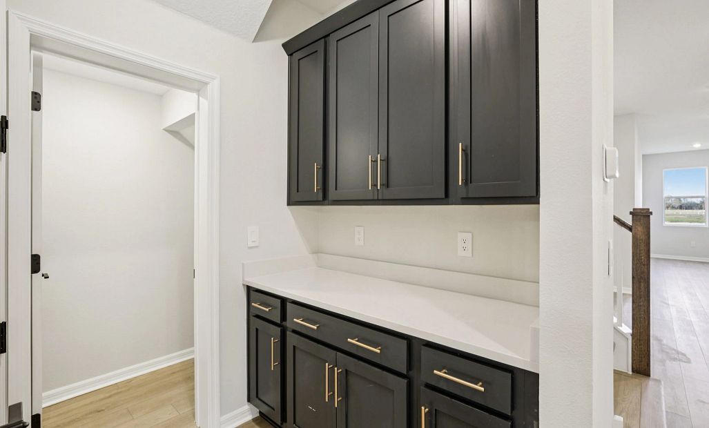 Valet space near garage featuring cabinets and countertops for optimal storage this will feature AW