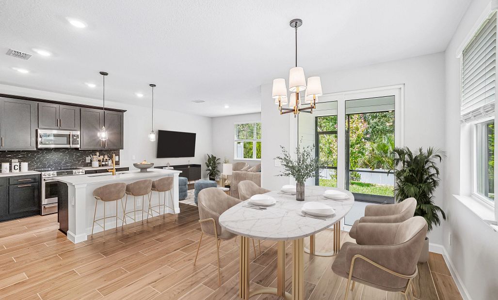 Virtually staged dining, kitchen and family room space