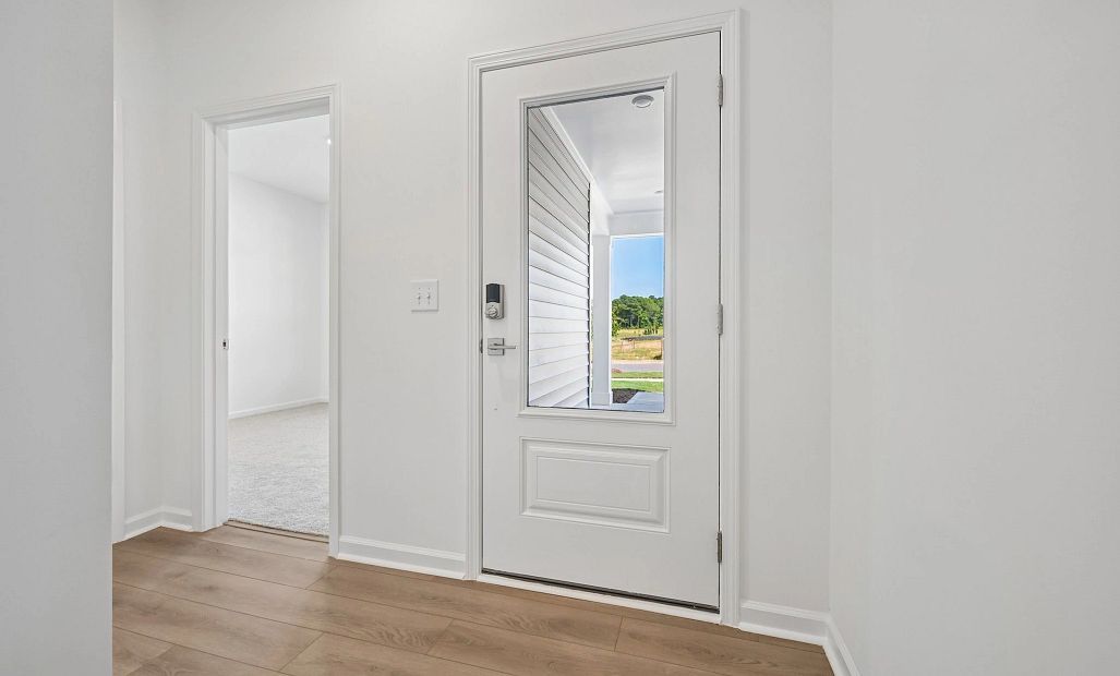 Foyer featuring the AW Collection® Milan - An entry with sleek tones and gallery-style flair.