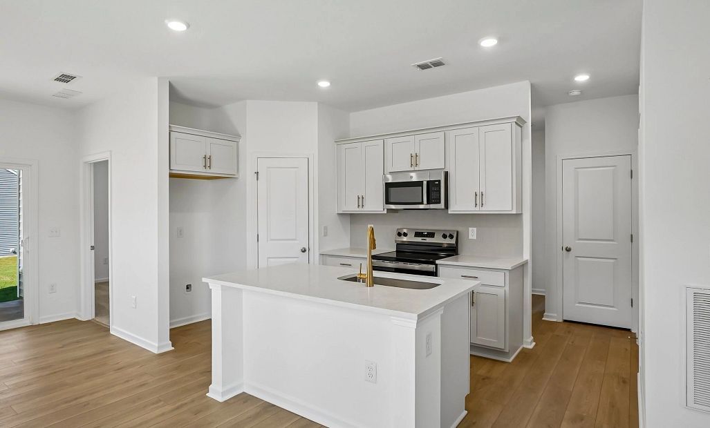 Kitchen featuring the AW Collection® Serene - Clean lines and earthy textures define the space.