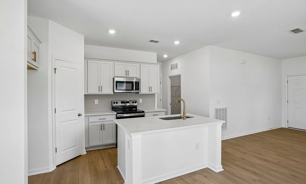 Kitchen featuring the AW Collection® Serene - Clean lines and earthy textures define the space.