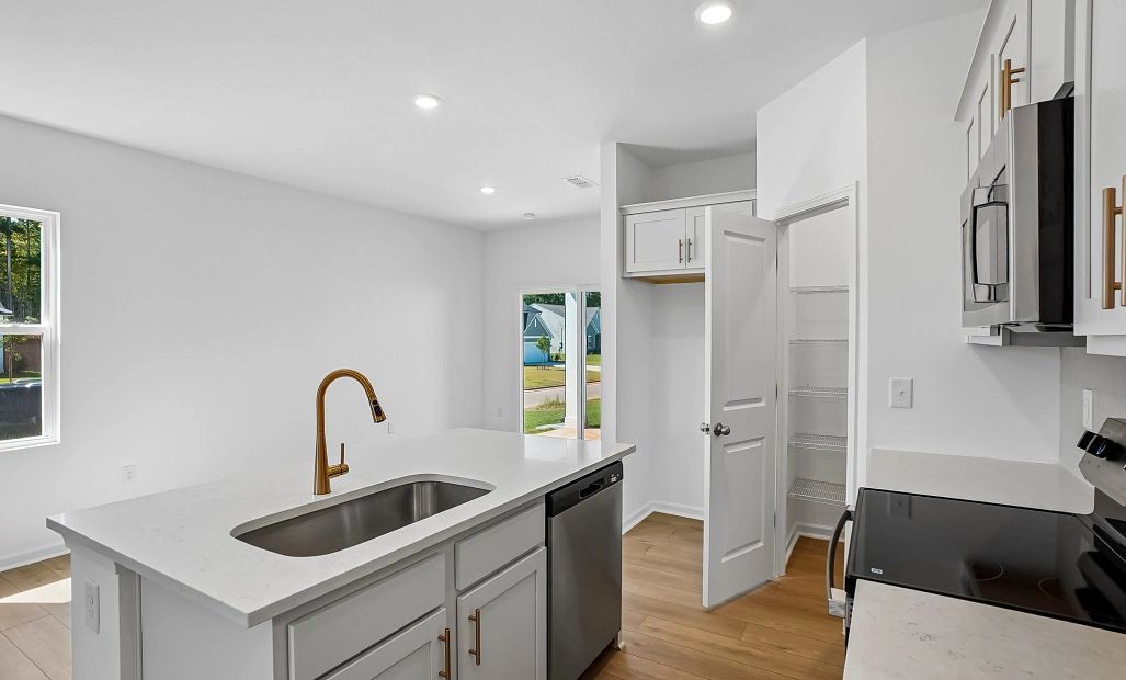 Kitchen featuring the AW Collection® Serene - Clean lines and earthy textures define the space.