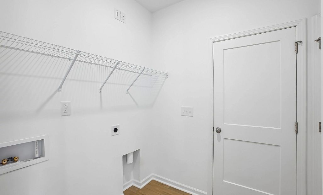 Laundry Room featuring the AW Collection® Serene - Light finishes and simple wire shelving.