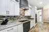 casa en The Gallagher Residence Photo Gallery por Regatta Building & Development II.