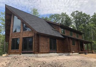 Wolverine Log Homes por Wolverine Log Homes en Traverse Michigan