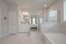 casa en Sunterra por Colina Homes