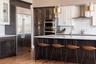 casa en Associates in Building + Design, Ltd. por Associates in Building + Design, Ltd.