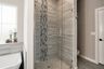 casa en Elevating Your Master Bath With Decorative Tiles por Butler Homes LLC