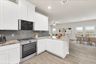 casa en Sunterra por Colina Homes