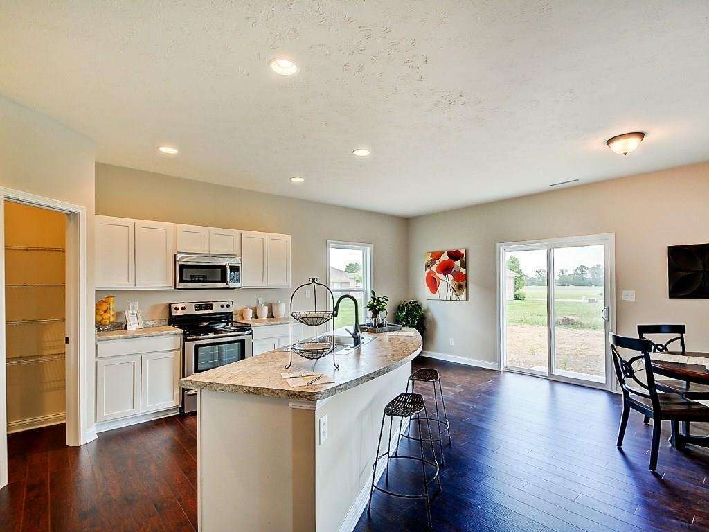 casa en Windstar Woods por Beacon Builders