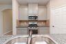 casa en Sunterra por Colina Homes