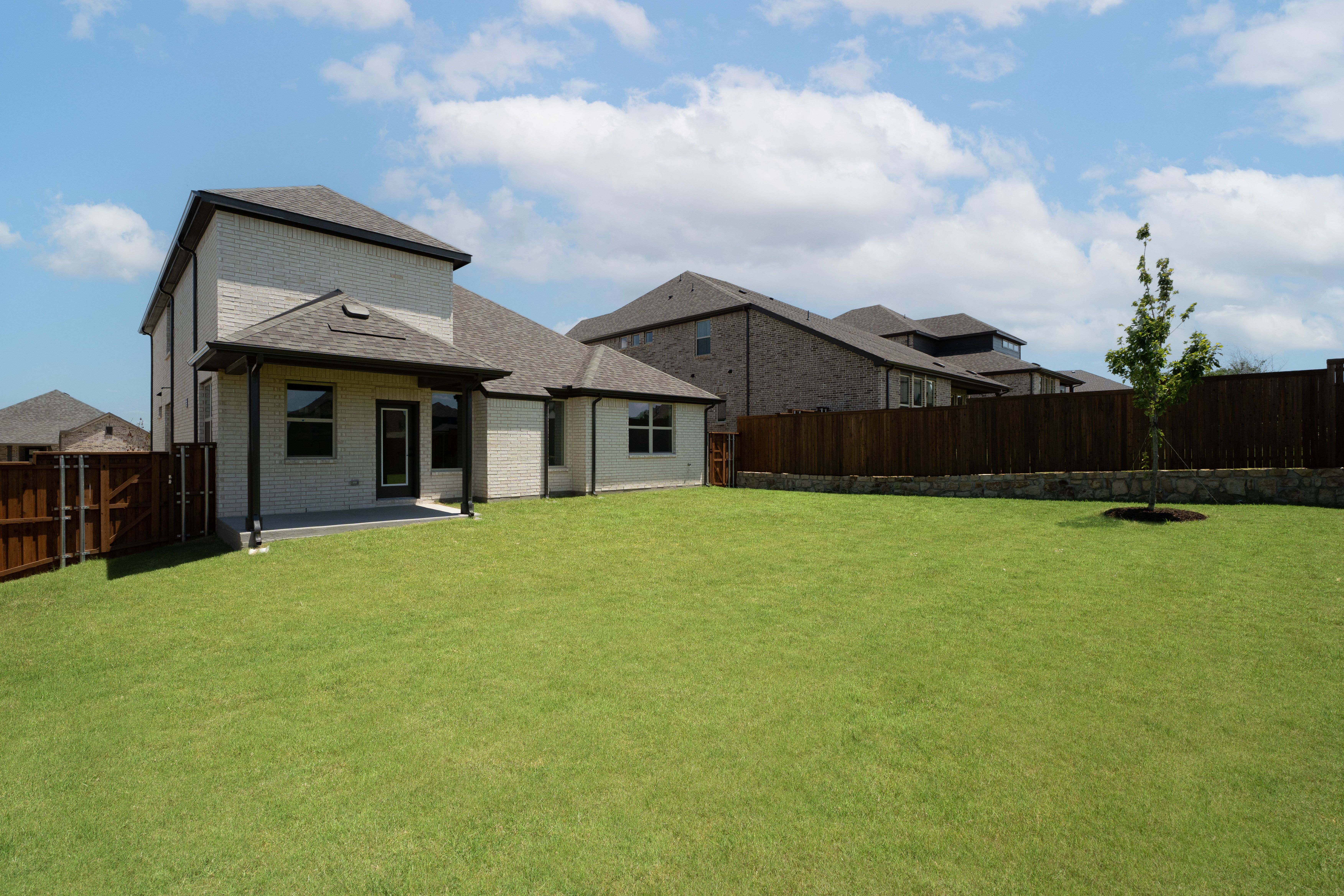 backyard with grass and covered patio