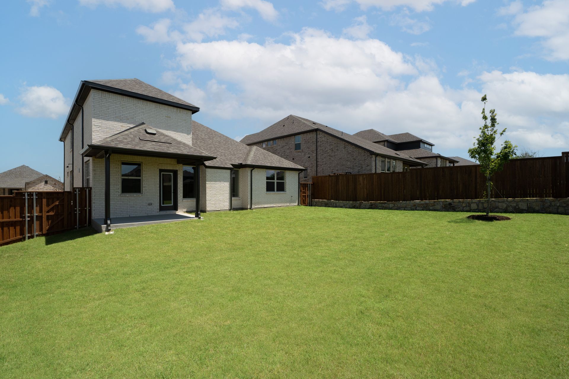 backyard with grass and covered patio