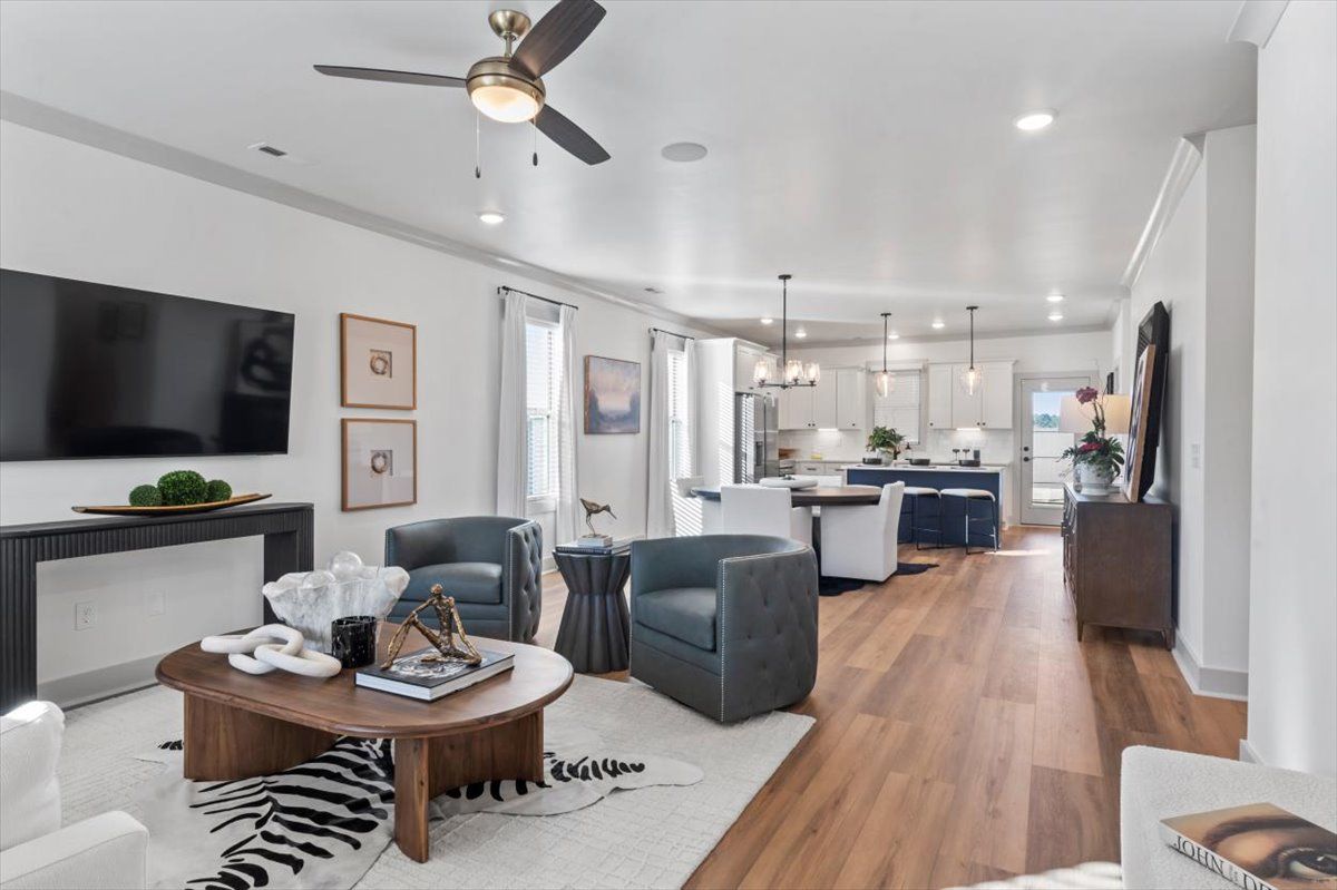 Beautiful Living area with ceiling fan, beautiful floors