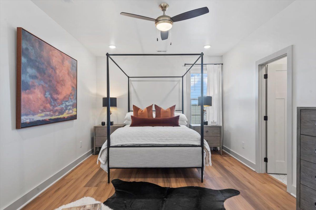 Master Bedroom with beautiful floors, ceiling fan and recessed lights