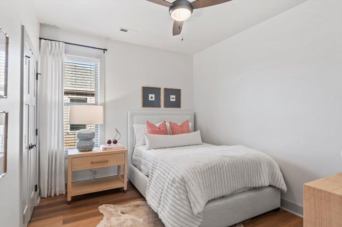 Fourth Bedroom with ceiling fan and natural light