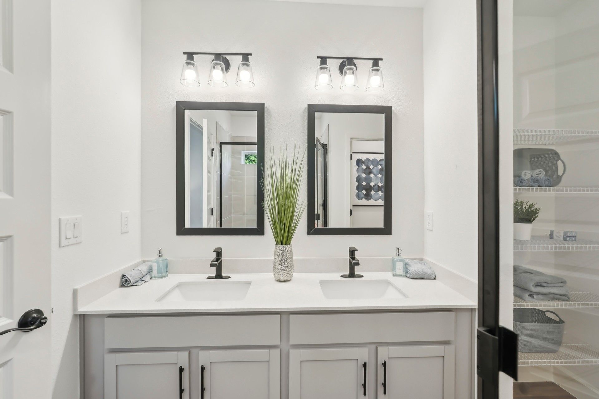 Elegant double vanity with striking black accents highlights luxury in North Port.